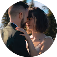 Caroline and Seamus holding each other in the evening light at their Montana wedding